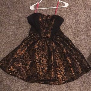 Black and gold mid thigh dress
